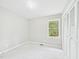 Bright bedroom featuring neutral walls, carpet, and natural light from the window and ample closet space at 2419 George Anderson Dr, Hillsborough, NC 27278