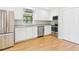 Modern kitchen featuring stainless steel appliances, granite countertops, and white cabinets at 2419 George Anderson Dr, Hillsborough, NC 27278
