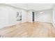 Spacious living room with hardwood floors, neutral paint, and large windows providing plenty of natural light at 2419 George Anderson Dr, Hillsborough, NC 27278