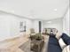 Staged living room and dining area with hardwood floors and neutral walls, great for entertaining at 2419 George Anderson Dr, Hillsborough, NC 27278
