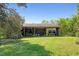Open-sided shed surrounded by trees, offering ample storage space and functionality on the property at 2510 Poplar Creek Rd, Henderson, NC 27537