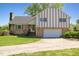 Charming two-story home featuring a brick facade and a spacious driveway leading to an attached garage at 2510 Poplar Creek Rd, Henderson, NC 27537