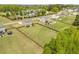 Aerial view of a well-maintained home with a large backyard, fencing, and ample outdoor space at 275 Sunrise Ridge Dr, Willow Springs, NC 27592