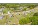 Residential community with many houses, green yards and surrounded by dense green forest in the background at 275 Sunrise Ridge Dr, Willow Springs, NC 27592