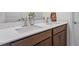 Bathroom featuring double sink vanity with quartz countertop and framed mirror at 275 Sunrise Ridge Dr, Willow Springs, NC 27592
