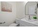 Clean half bathroom with a mirror and modern vanity at 275 Sunrise Ridge Dr, Willow Springs, NC 27592