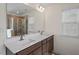 Bathroom featuring double sink vanity with quartz countertop and framed mirror at 275 Sunrise Ridge Dr, Willow Springs, NC 27592