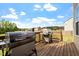 Open-air deck featuring a grill and cooking space, ideal for entertaining and enjoying outdoor meals at 275 Sunrise Ridge Dr, Willow Springs, NC 27592