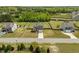 Charming two-story home with a well-manicured lawn and a paved driveway leading to an attached garage at 275 Sunrise Ridge Dr, Willow Springs, NC 27592