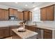 Modern kitchen features granite countertops, stainless steel appliances, and white tile backsplash at 275 Sunrise Ridge Dr, Willow Springs, NC 27592