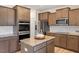 Kitchen featuring stainless steel appliances, granite counters, and shaker style cabinets at 275 Sunrise Ridge Dr, Willow Springs, NC 27592