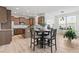 Open kitchen features modern stainless steel appliances and a cozy breakfast nook at 275 Sunrise Ridge Dr, Willow Springs, NC 27592