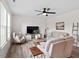 Inviting living room with ceiling fan, natural light, and comfortable seating for a cozy atmosphere at 275 Sunrise Ridge Dr, Willow Springs, NC 27592