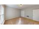 Cozy carpeted bedroom with ample natural light from a window and a double door closet at 2750 Laurelcherry St, Raleigh, NC 27612
