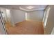 Spacious bedroom boasts plush carpet, recessed lighting, and two bright windows at 2750 Laurelcherry St, Raleigh, NC 27612