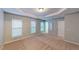 Bright bedroom offers neutral walls, plush carpet, and two double windows at 2750 Laurelcherry St, Raleigh, NC 27612