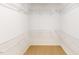Walk-in closet with white wire shelving provides ample storage solutions at 2750 Laurelcherry St, Raleigh, NC 27612