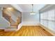 Formal dining room featuring hardwood floors, wainscoting, and a chandelier at 2750 Laurelcherry St, Raleigh, NC 27612