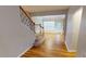 Entry foyer with wood floors and a carpeted staircase at 2750 Laurelcherry St, Raleigh, NC 27612