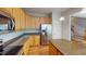 Kitchen featuring stainless steel appliances, wood floors, and a kitchen island at 2750 Laurelcherry St, Raleigh, NC 27612