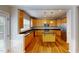 Spacious kitchen featuring an island, wood floors, and wooden cabinets at 2750 Laurelcherry St, Raleigh, NC 27612