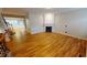 Spacious living room featuring a fireplace, hardwood floors, and white trim at 2750 Laurelcherry St, Raleigh, NC 27612