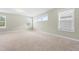 Bright, spacious bedroom with neutral carpet, ample natural light, and a comfortable atmosphere at 2901 Murray Ridge Trl, Apex, NC 27502