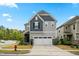 Beautiful two-story home with a two car garage and manicured front yard at 2901 Murray Ridge Trl, Apex, NC 27502