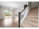 Open-concept featuring an island kitchen, dining area and stairway to the second floor at 2901 Murray Ridge Trl, Apex, NC 27502