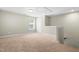 Open loft space with neutral carpet, natural light, and versatile living area at 2901 Murray Ridge Trl, Apex, NC 27502