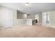 Spacious loft area with neutral carpet, open layout, and access to multiple rooms at 2901 Murray Ridge Trl, Apex, NC 27502
