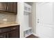 Convenient mudroom features a built-in bench and storage, with easy access to the kitchen at 2901 Murray Ridge Trl, Apex, NC 27502