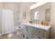 Bathroom features a modern vanity, framed mirror, and shower-tub combination with linen curtain at 314 Bledsoe Ave, Raleigh, NC 27601