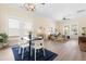 Open-concept dining and living area filled with natural light and modern decor including a large modern table at 314 Bledsoe Ave, Raleigh, NC 27601