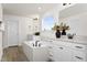 Bright bathroom featuring a soaking tub, quartz countertops, and a dual sink vanity for a spa-like experience at 315 Adams Pointe Ct, Angier, NC 27501