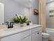 Modern bathroom featuring dual sinks, granite countertop, and a tiled shower-tub combination, perfect for everyday use at 315 Adams Pointe Ct, Angier, NC 27501