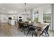 A spacious open concept living area seamlessly connecting the kitchen, dining, and living spaces at 315 Adams Pointe Ct, Angier, NC 27501