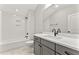 Clean bathroom with a tub, shower, white subway tile, and a modern vanity with dark fixtures at 3221 Skycrest Dr, Raleigh, NC 27604