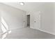 Bright bedroom features neutral walls, plush carpet, and white trim for a clean, modern look at 3221 Skycrest Dr, Raleigh, NC 27604