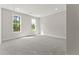 Bright, spacious bedroom with natural light, plush carpeting, and calming, neutral walls at 3221 Skycrest Dr, Raleigh, NC 27604