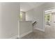 Upstairs hallway with neutral walls and carpet leading to bedrooms, creating a welcoming transition space at 3221 Skycrest Dr, Raleigh, NC 27604