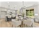 Charming kitchen with modern appliances, island seating, and an open dining area with access to the deck at 3221 Skycrest Dr, Raleigh, NC 27604