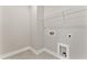 Functional laundry room with a wire rack and utility connections ready for appliances at 3221 Skycrest Dr, Raleigh, NC 27604