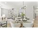 Open-concept living area with lots of seating, modern decor, and bright natural light at 3221 Skycrest Dr, Raleigh, NC 27604