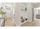 Hallway with mudroom bench, storage cubbies, and decor at 3221 Skycrest Dr, Raleigh, NC 27604
