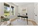 Bright home office with natural light, neutral decor and a modern desk at 3221 Skycrest Dr, Raleigh, NC 27604