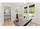 Bright home office with natural light, neutral decor and a modern desk at 3221 Skycrest Dr, Raleigh, NC 27604