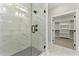 Modern walk-in shower with marble tile and glass door, offering a spa-like experience at 3221 Skycrest Dr, Raleigh, NC 27604