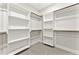 Spacious walk-in closet with ample shelving and hanging space, perfect for organizing your wardrobe at 3221 Skycrest Dr, Raleigh, NC 27604