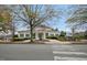 Community clubhouse featuring yellow siding, black shutters and a decorative front entrance at 3300 Magical Pl, Raleigh, NC 27614